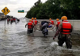 Soldiers with the Texas Army National Guard wade through rising floodwaters on the streets of Houston on Aug. 28, 2017